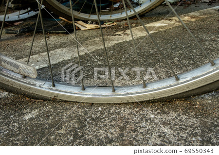 Front wheel of a flat bicycle Front wheel of a flat bicycle 69550343