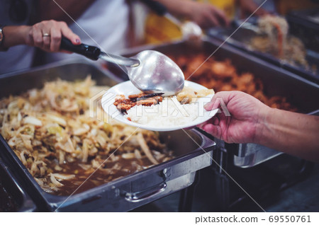 feeding to hand the poor helping beggar in social, Poverty concept feeding to hand the poor helping beggar in social, Poverty concept 69550761