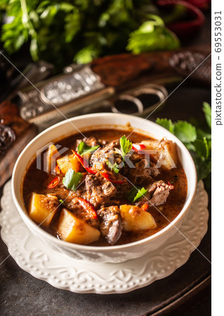Deer stew in a bowl hunting weapon as a decoration 69553031