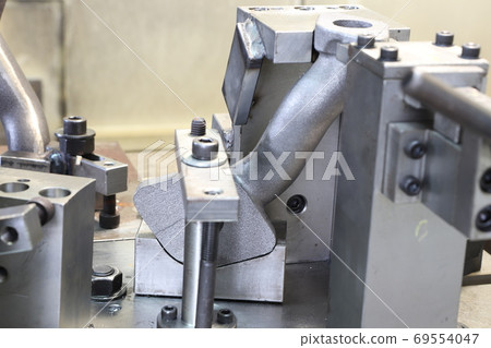 iron casting pipes were clamped on jig , ready for machining pro iron casting pipes were clamped on jig , ready for machining pro 69554047