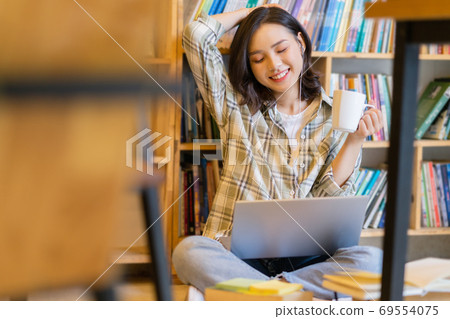 Woman in library Woman in library 69554075
