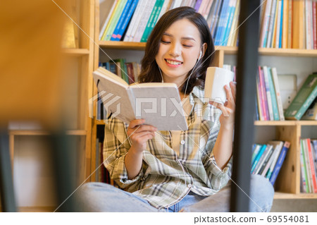 Woman in library Woman in library 69554081