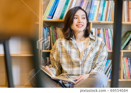 Woman in library Woman in library 69554084
