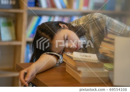 Woman in library Woman in library 69554108