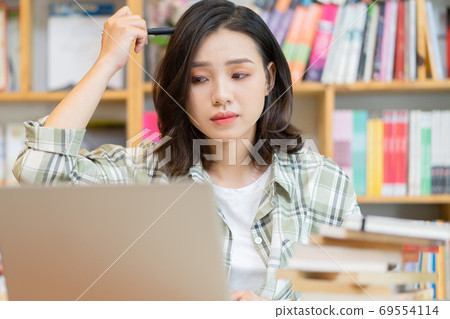 Woman in library Woman in library 69554114