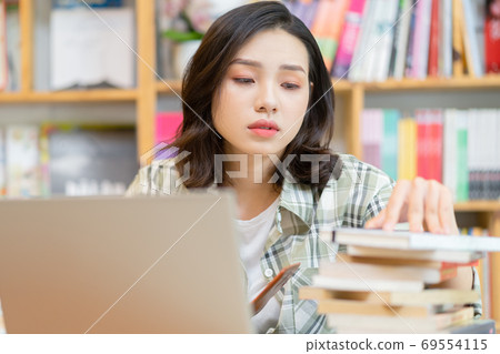 Woman in library 69554115