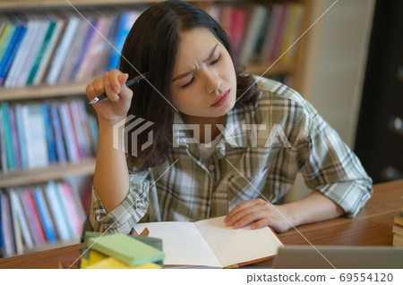 Woman in library Woman in library 69554120