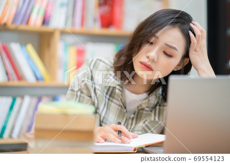 Woman in library Woman in library 69554123