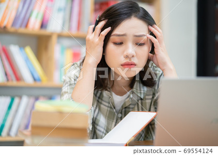 Woman in library 69554124