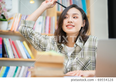 Woman in library 69554128