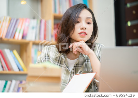 Woman in library 69554129