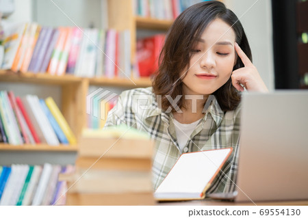 Woman in library Woman in library 69554130
