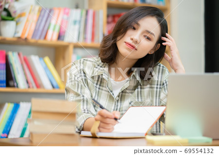 Woman in library Woman in library 69554132