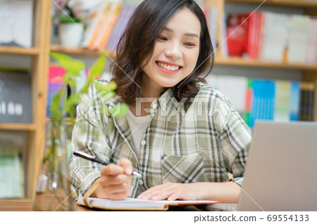 Woman in library 69554133