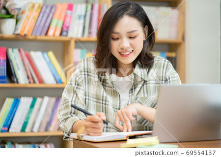 Woman in library Woman in library 69554137