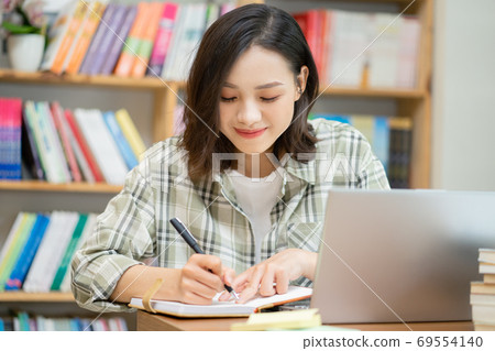 Woman in library Woman in library 69554140