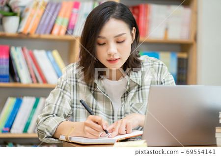 Woman in library Woman in library 69554141