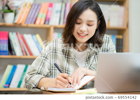 Woman in library Woman in library 69554142