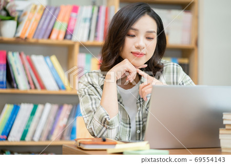 Woman in library Woman in library 69554143