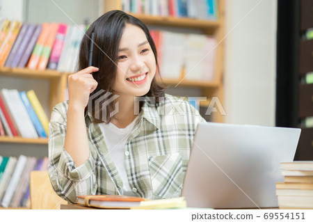 Woman in library Woman in library 69554151