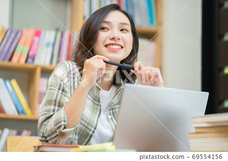 Woman in library 69554156