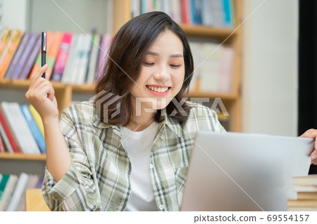 Woman in library 69554157