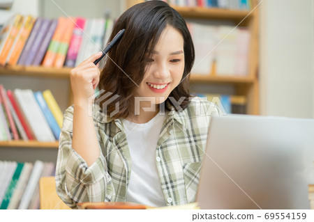 Woman in library Woman in library 69554159