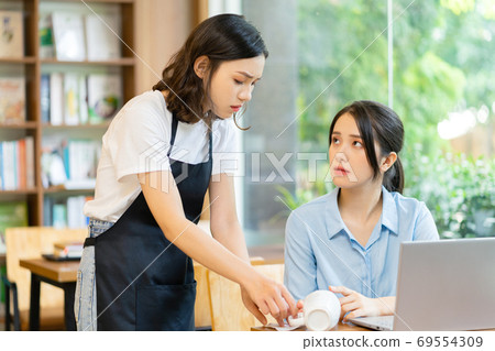 Woman in coffee shop Woman in coffee shop 69554309