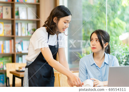Woman in coffee shop Woman in coffee shop 69554311