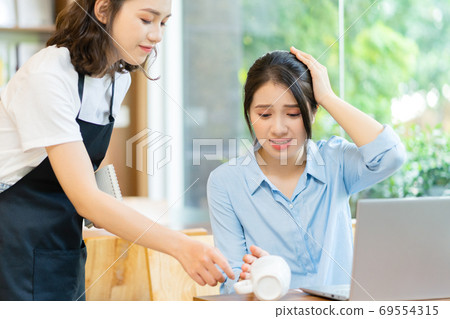 Woman in coffee shop Woman in coffee shop 69554315