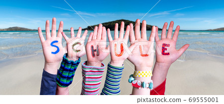 Children Hands Building Word Schule Means School, Ocean Background Children Hands Building Word Schule Means School, Ocean Background 69555001