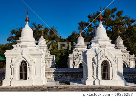 The White stupa temple of Kuthodaw in Mandalay, Myanmar, former Burma 69556297
