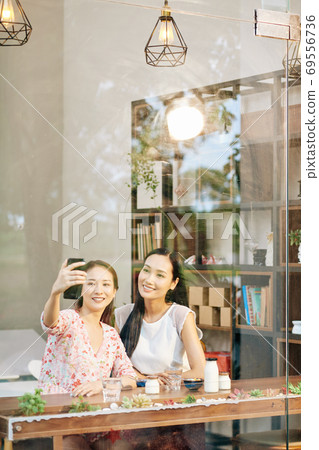 Friends taking selfie 69556736