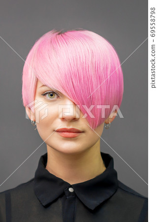 Woman with short bright pink hair 69558798