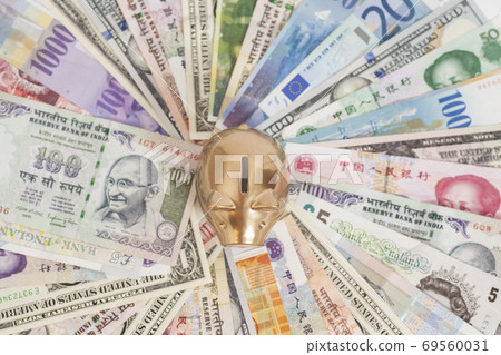 Golden piggy bank with International currencies 69560031