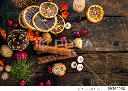 Xmas Symbols such as nuts, orange slices, tree branches, cranberries Xmas Symbols such as nuts, orange slices, tree branches, cranberries 69560068