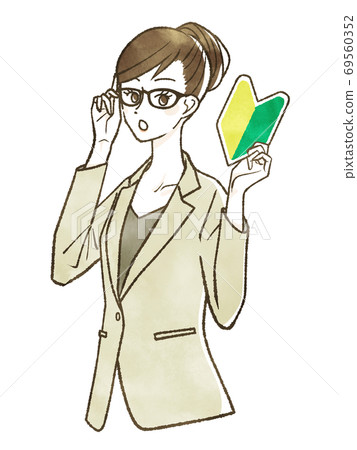 A woman in a suit holding a beginner mark 69560352