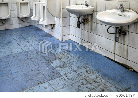 Old scruffy toilet where the floor is wet and filled with dirty footprints of student,filthy of urinals,washbasin,tiled wall, unhygienic,dirty restroom or has not cleaned the bathroom,back to school Old scruffy toilet where the floor is wet and filled with dirty footprints of student,filthy of urinals,washbasin,tiled wall, unhygienic,dirty restroom or has not cleaned the bathroom,back to school 69561487