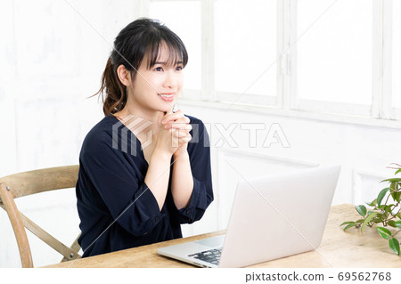 Young woman making a request gesture 69562768