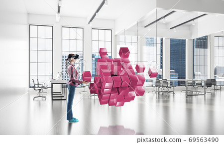 Girl in virtual reality mask experiencing virtual technology world. Mixed media Girl in virtual reality mask experiencing virtual technology world. Mixed media 69563490