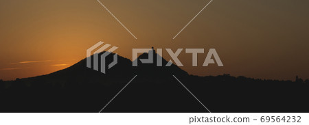 Sunrise and view of the silhouette of the castle Sunrise and view of the silhouette of the castle 69564232