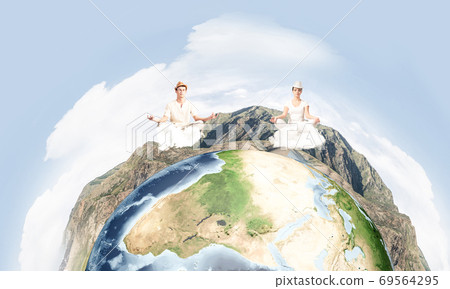 Young couple keeping mind conscious. Young couple keeping mind conscious. 69564295