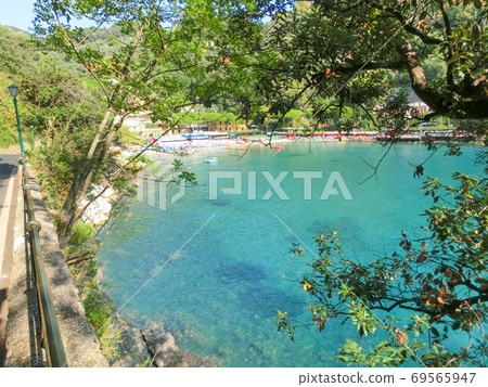 beach known as paraggi near portofino in genoa on a blue sky and sea background beach known as paraggi near portofino in genoa on a blue sky and sea background 69565947