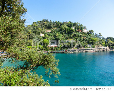 The beach near portofino in genoa on a blue sky and sea background The beach near portofino in genoa on a blue sky and sea background 69565948