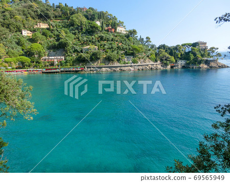 The beach near portofino in genoa on a blue sky and sea background The beach near portofino in genoa on a blue sky and sea background 69565949