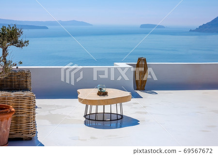Table on the Santorini Sun Terrace and Sea View Table on the Santorini Sun Terrace and Sea View 69567672