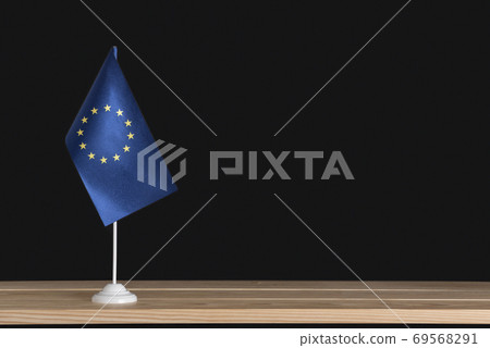 Flag pole. National table flag of EU on black background. Flag pole. National table flag of EU on black background. 69568291