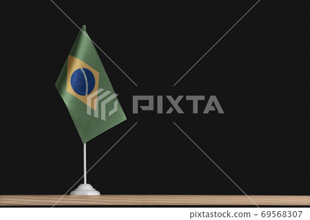 Flag pole. National table flag of Brazil on black background. Copy space 69568307