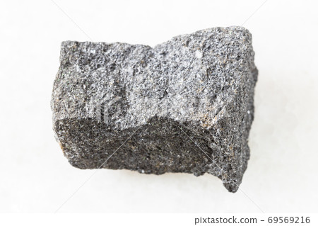 unpolished Chromite rock on white marble 69569216