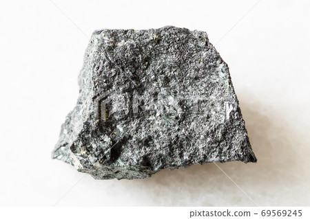rough Magnetite ore on white marble 69569245